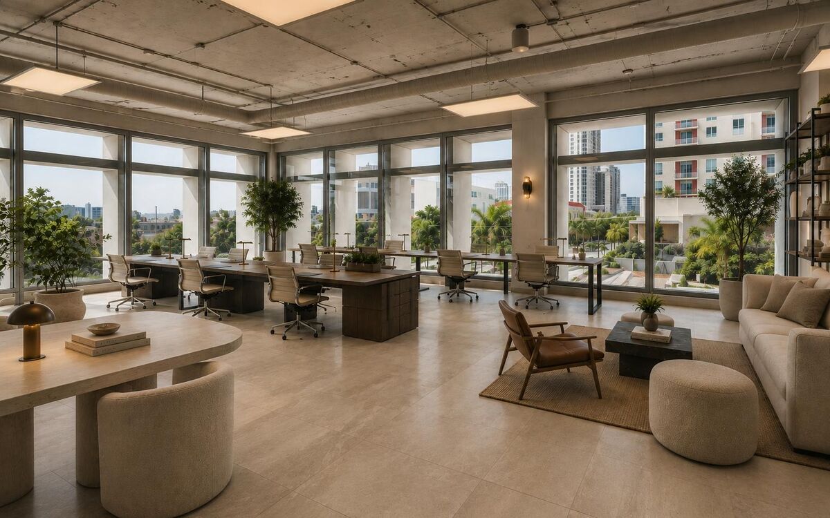 Sunlit office suite with lounge seating and city views